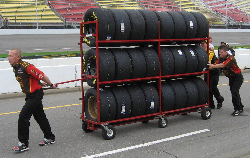 Tires, tires, tires, and then there were people BUYING used tires, and people having the used tires they bought autographed. Must have been a LONG walk back to the car... or did they hold those on their lap the entire race?